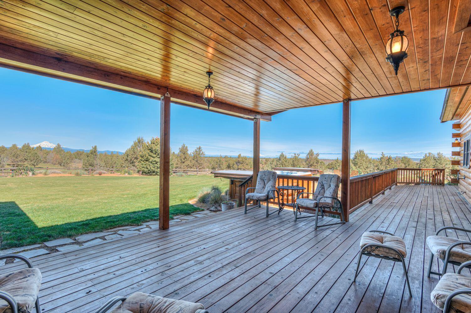 10000 Southwest Lyons Drive Culver, OR 97734 - Photo 50 of 90 a view of a balcony with wooden floor and outdoor seating