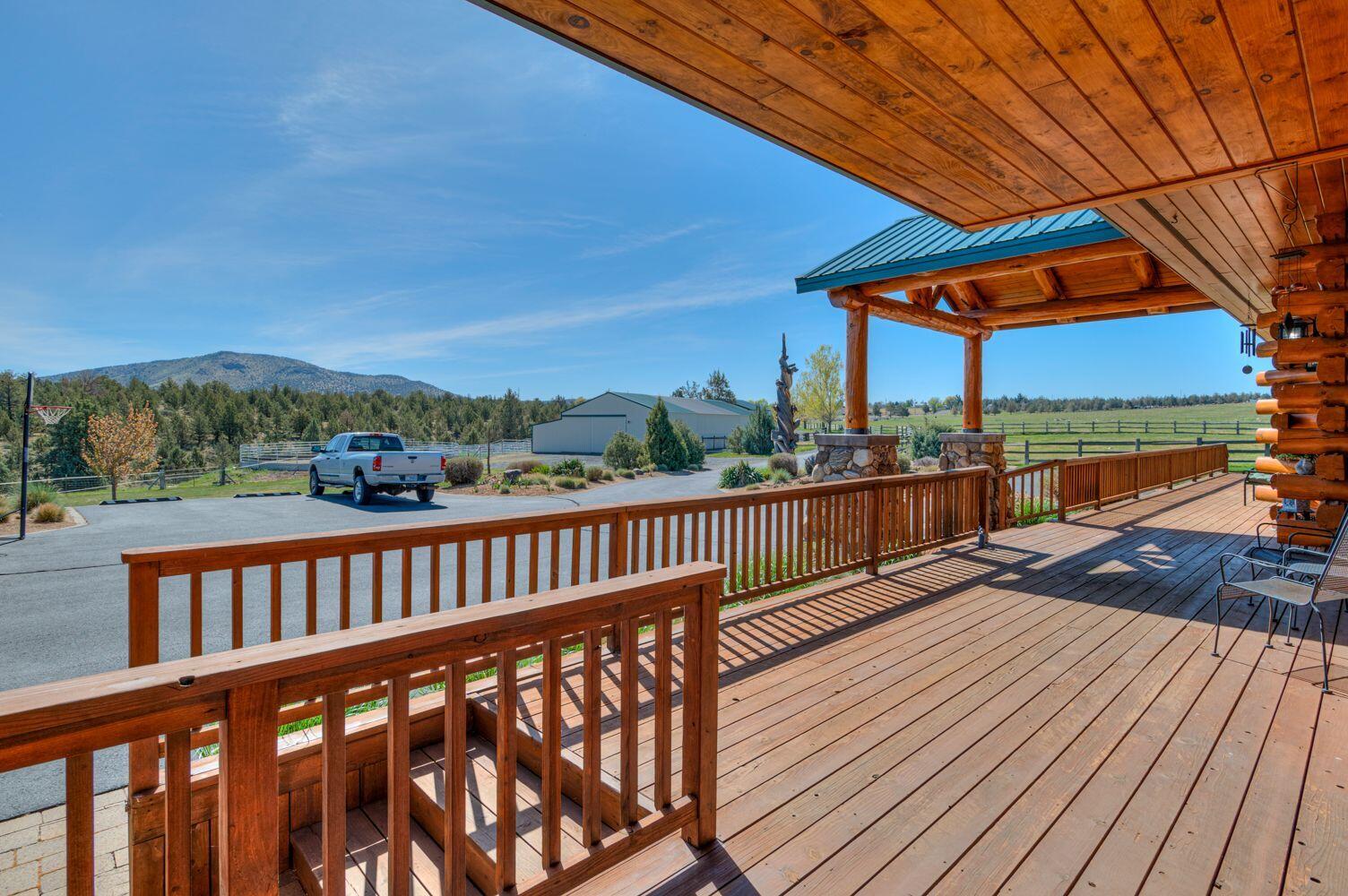 10000 Southwest Lyons Drive Culver, OR 97734 - Photo 57 of 90 a view of a roof deck with wooden floor and fence