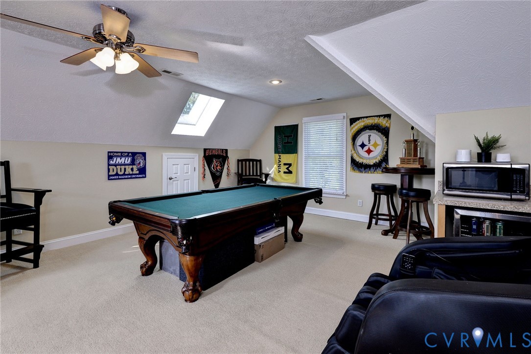 4015 Cold Spring Road Williamsburg, VA 23188 - Photo 35 of 57 Carpeted bonus room with a pitched ceiling, skylig