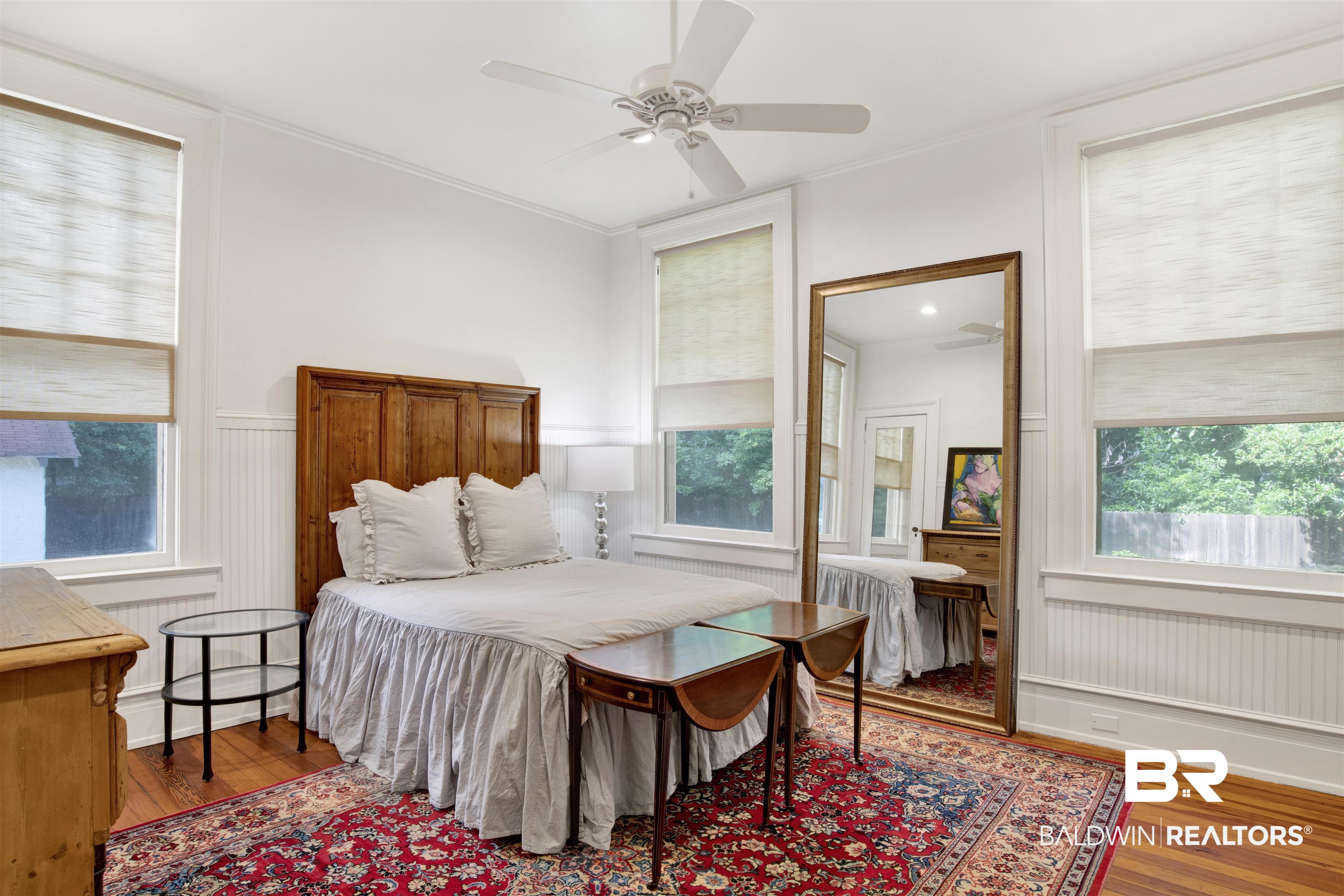 1654 Government Street Mobile, AL 36604 - Photo 34 of 45 Bedroom with ornamental molding, multiple windows, ceiling fan, and hardwood / wood-style floors