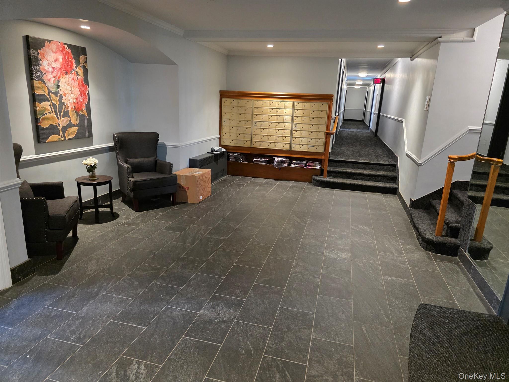70 Locust Avenue, Unit B505 New Rochelle, NY 10801 - Photo 4 of 14 a lobby with furniture and a flat screen tv