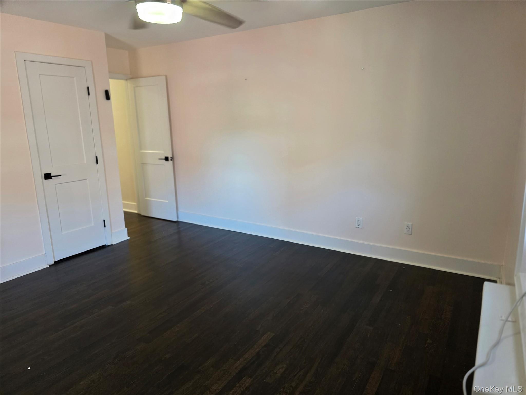 70 Locust Avenue, Unit B505 New Rochelle, NY 10801 - Photo 6 of 14 wooden floor in an empty room