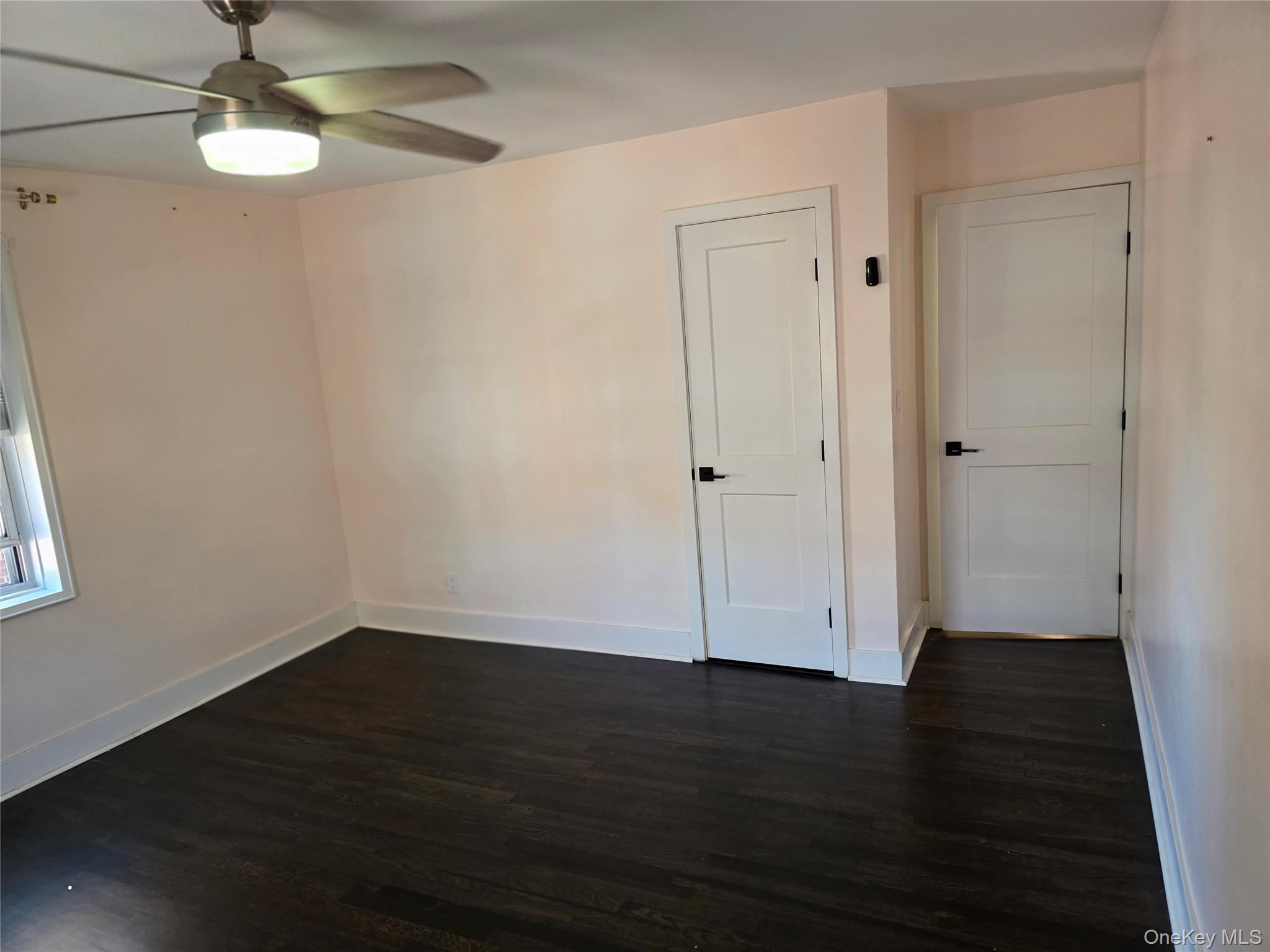70 Locust Avenue, Unit B505 New Rochelle, NY 10801 - Photo 7 of 14 a view of empty room with wooden floor