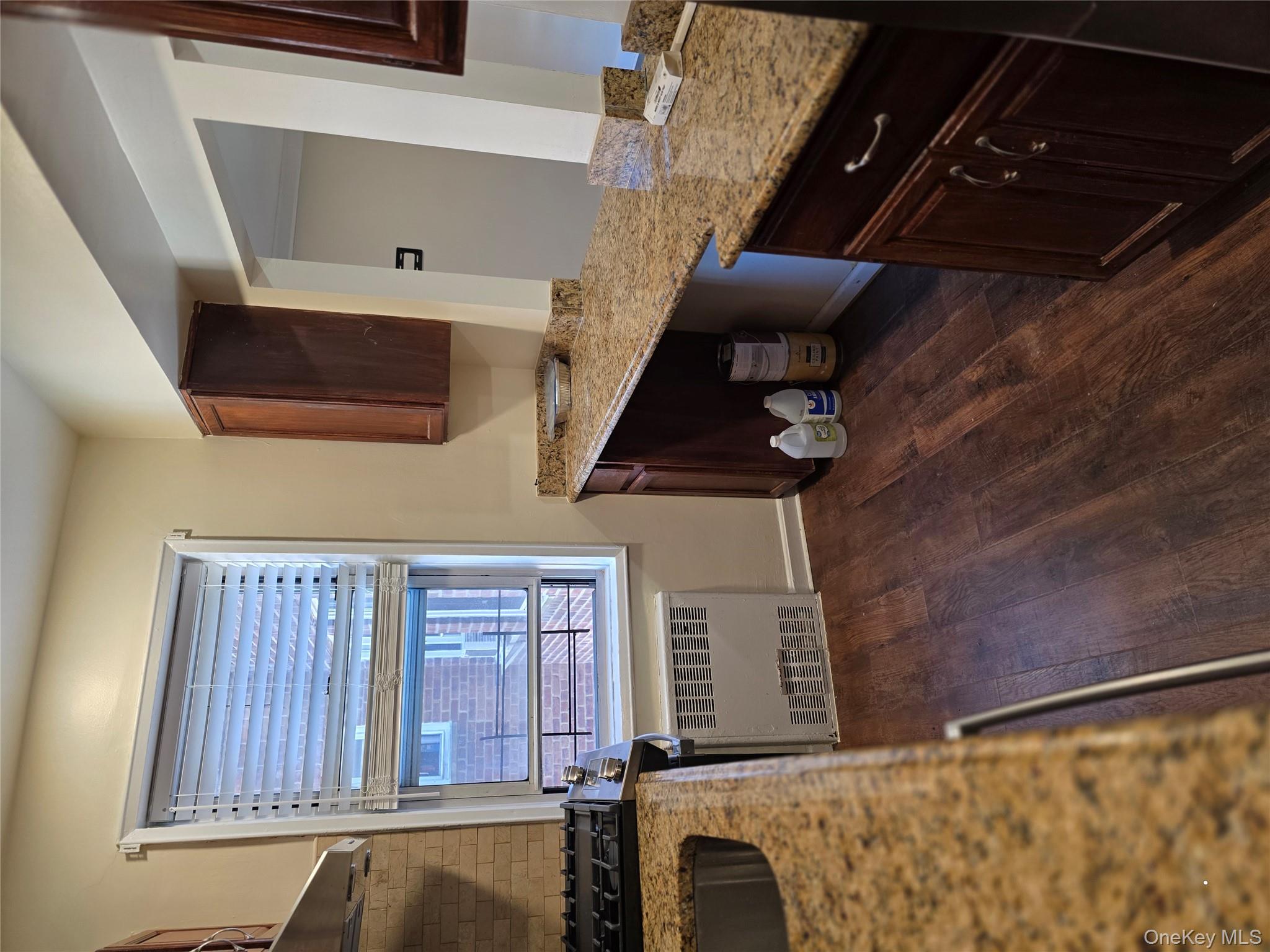 70 Locust Avenue, Unit B505 New Rochelle, NY 10801 - Photo 9 of 14 a view of a kitchen with granite countertop a sink and a stove top oven