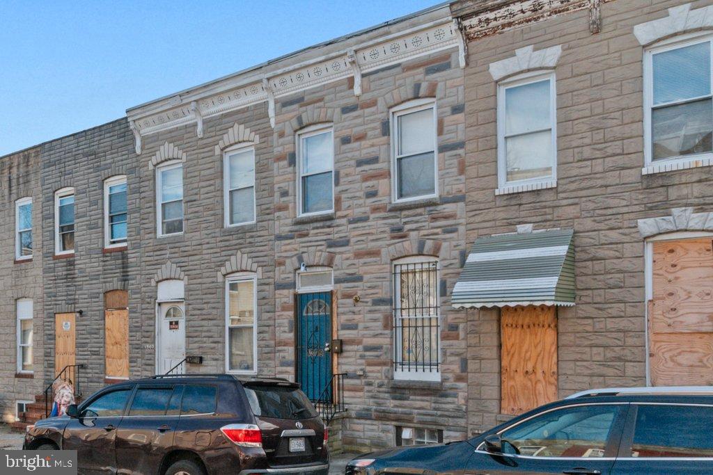 1309 Kuper Place Baltimore, MD 21223 - Photo 20 of 20 a front view of a building with parking space