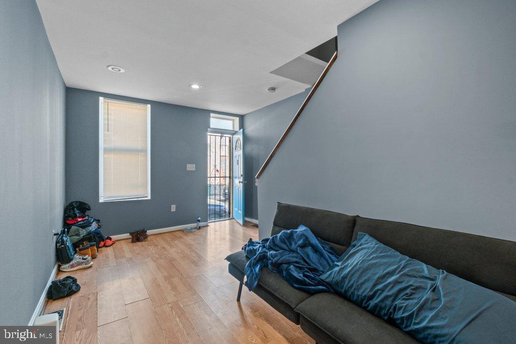 1309 Kuper Place Baltimore, MD 21223 - Photo 2 of 20 a living room with furniture and a potted plant