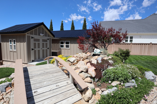 1055 North 1000 East Mapleton, UT 84664 - Photo 98 of 112 Decorative wooden bridge crossing a rock garden with varied plantings