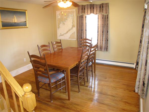 99 Moosehill Road Walpole, MA 02032 - Photo 11 of 22 a view of a dining room with furniture and wooden floor