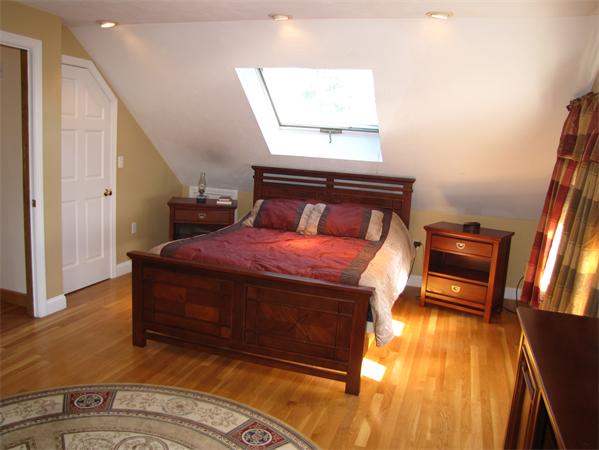 99 Moosehill Road Walpole, MA 02032 - Photo 14 of 22 a bed sitting in a room next to a window