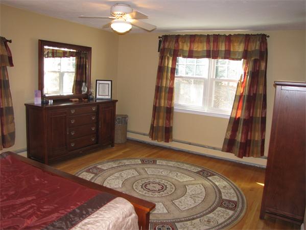 99 Moosehill Road Walpole, MA 02032 - Photo 15 of 22 a bedroom with a bed and a mirror