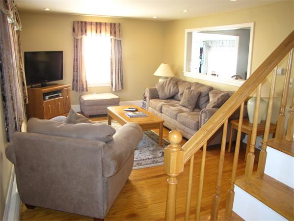 99 Moosehill Road Walpole, MA 02032 - Photo 10 of 22 a living room with furniture and a flat screen tv