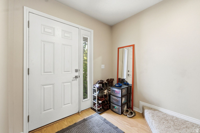 515 Inverness Lane, Unit 207 Heber City, UT 84032 - Photo 3 of 26 Entryway with light wood-style floors and baseboards