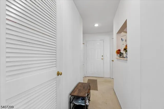 a spacious bedroom with a bed and a table in it