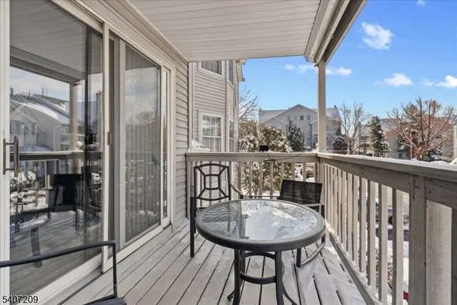 a car parked in front of a white building