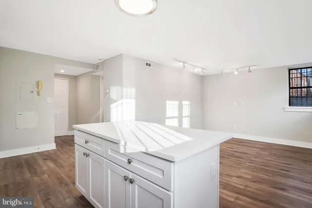 a room with a bed and a mirror