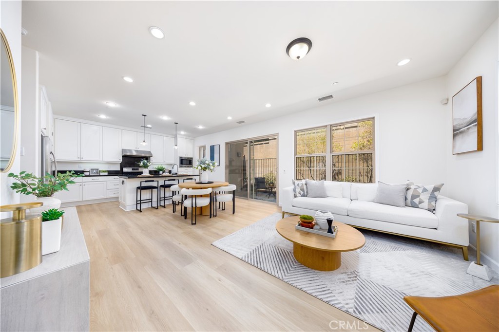154 Firefly Irvine, CA 92618 - Photo 1 of 34 a living room with furniture and a wooden floor