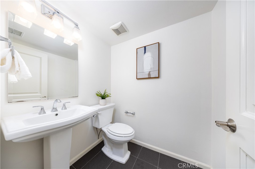 154 Firefly Irvine, CA 92618 - Photo 11 of 34 a bathroom with a toilet sink and mirror