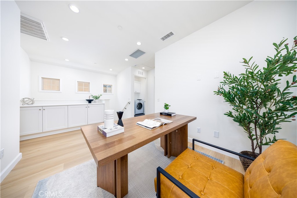 154 Firefly Irvine, CA 92618 - Photo 14 of 34 a view of a kitchen with kitchen island a stove a sink a refrigerator and a counter space