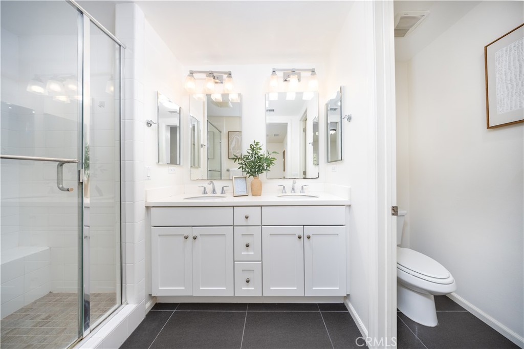 154 Firefly Irvine, CA 92618 - Photo 19 of 34 a bathroom with a sink a toilet and shower