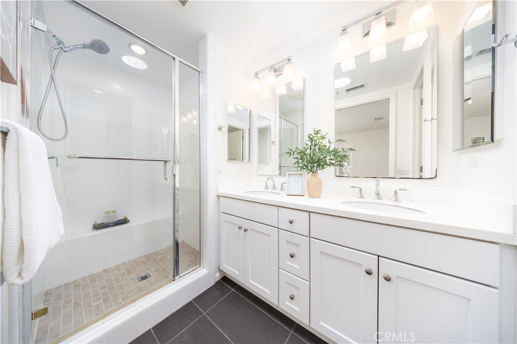 154 Firefly Irvine, CA 92618 - Photo 20 of 34 a bathroom with a shower sink and mirror