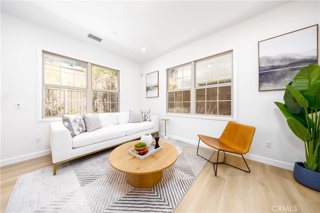 154 Firefly Irvine, CA 92618 - Photo 3 of 34 a living room with furniture and a window
