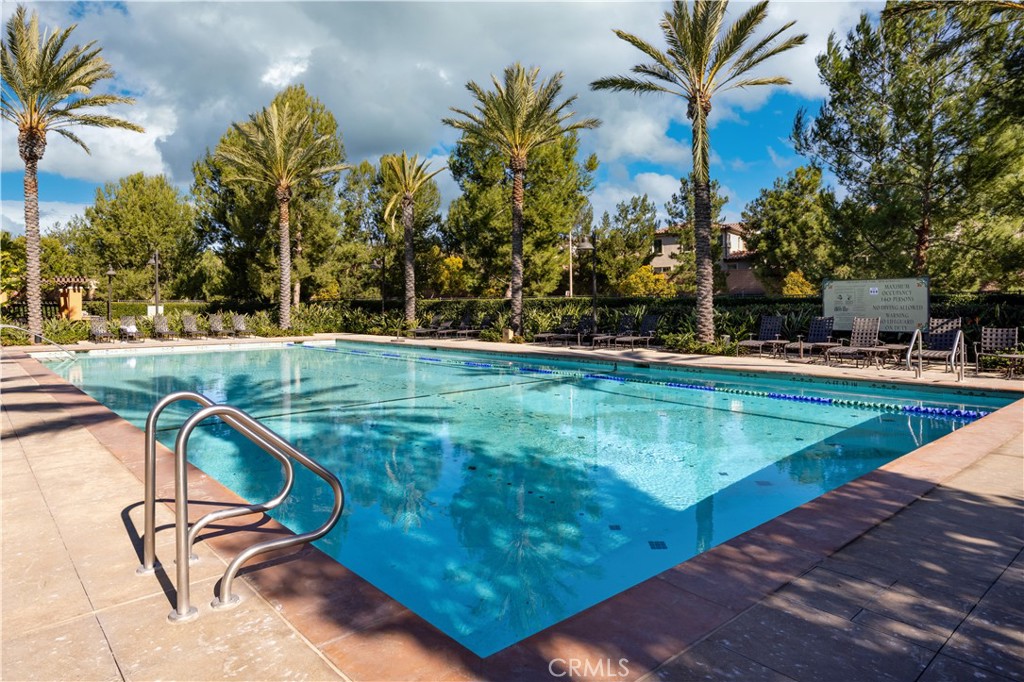 154 Firefly Irvine, CA 92618 - Photo 31 of 34 a view of a swimming pool with lawn chairs and plants