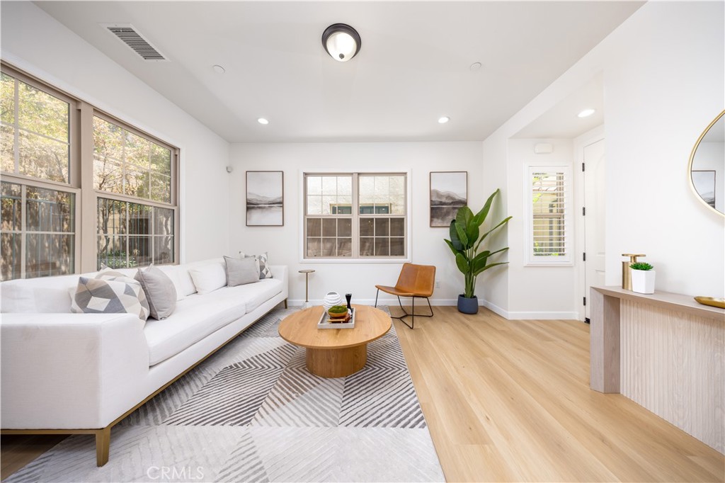 154 Firefly Irvine, CA 92618 - Photo 4 of 34 a living room with furniture and a large window