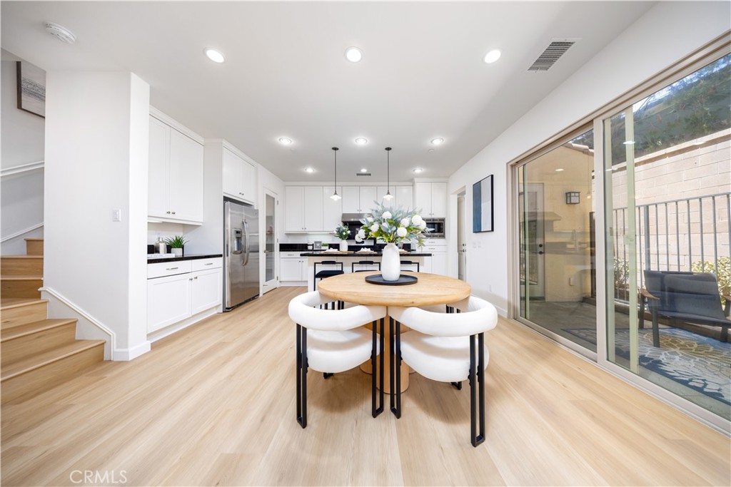 154 Firefly Irvine, CA 92618 - Photo 5 of 34 a kitchen with a table and chairs