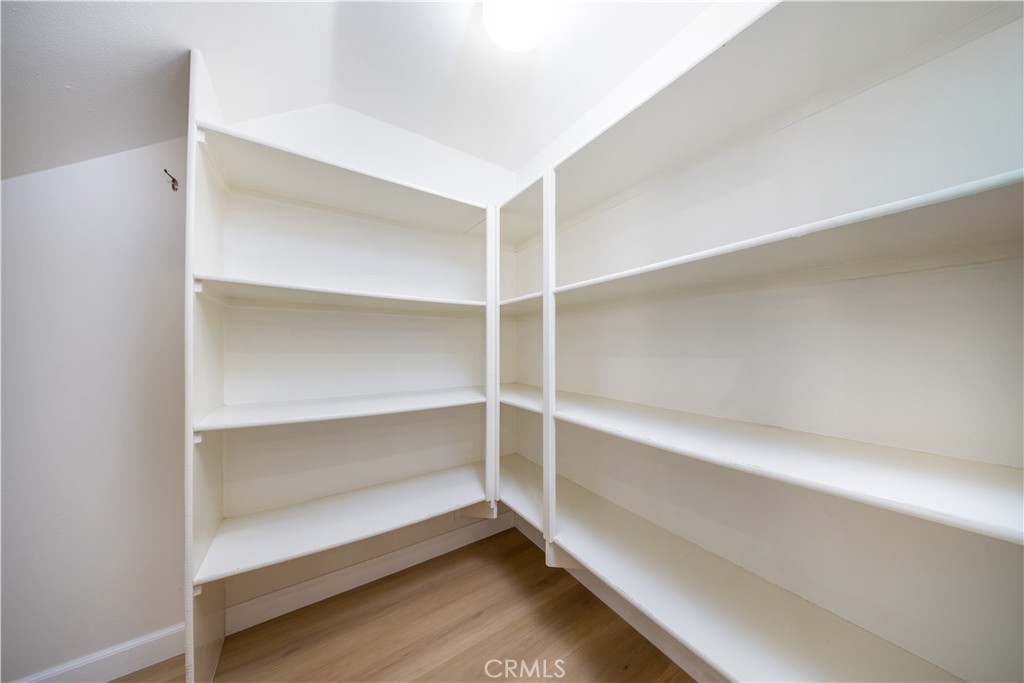 154 Firefly Irvine, CA 92618 - Photo 9 of 34 a storage room with empty racks