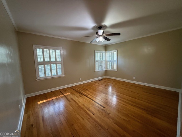 1221 Ridge Avenue North Tifton, GA 31794 - Photo 19 of 29 a view of an empty room with wooden floor and a window