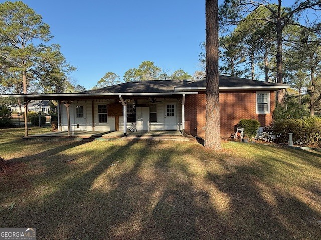 1221 Ridge Avenue North Tifton, GA 31794 - Photo 25 of 29 a front view of a house with garden