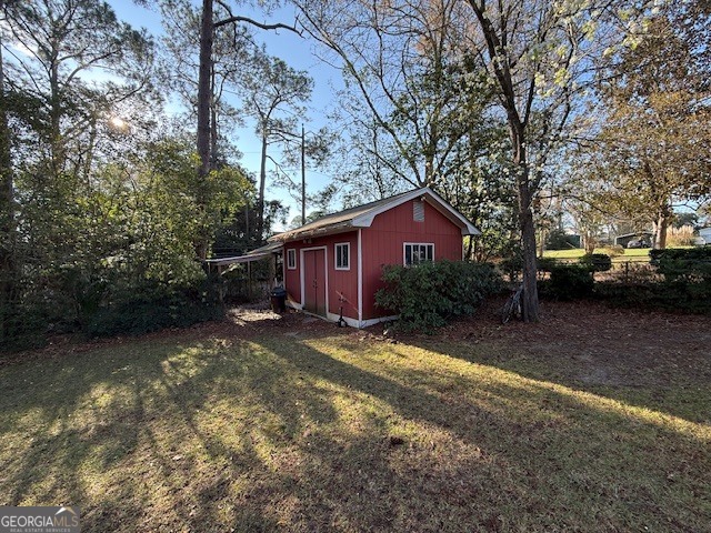 1221 Ridge Avenue North Tifton, GA 31794 - Photo 27 of 29 a view of a house with a yard covered in snow