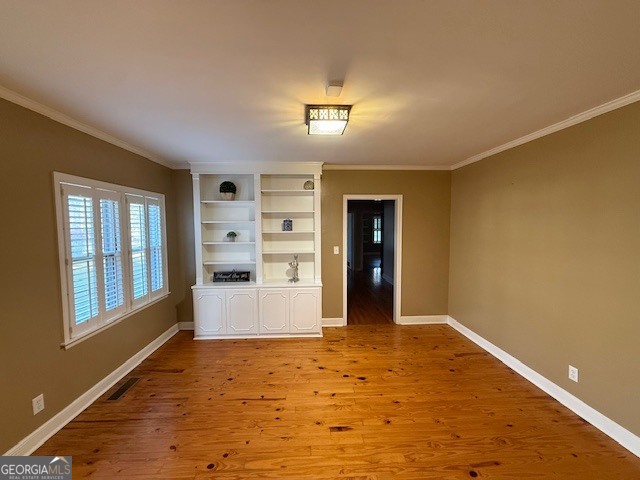 1221 Ridge Avenue North Tifton, GA 31794 - Photo 6 of 29 a view of empty room with wooden floor and windows