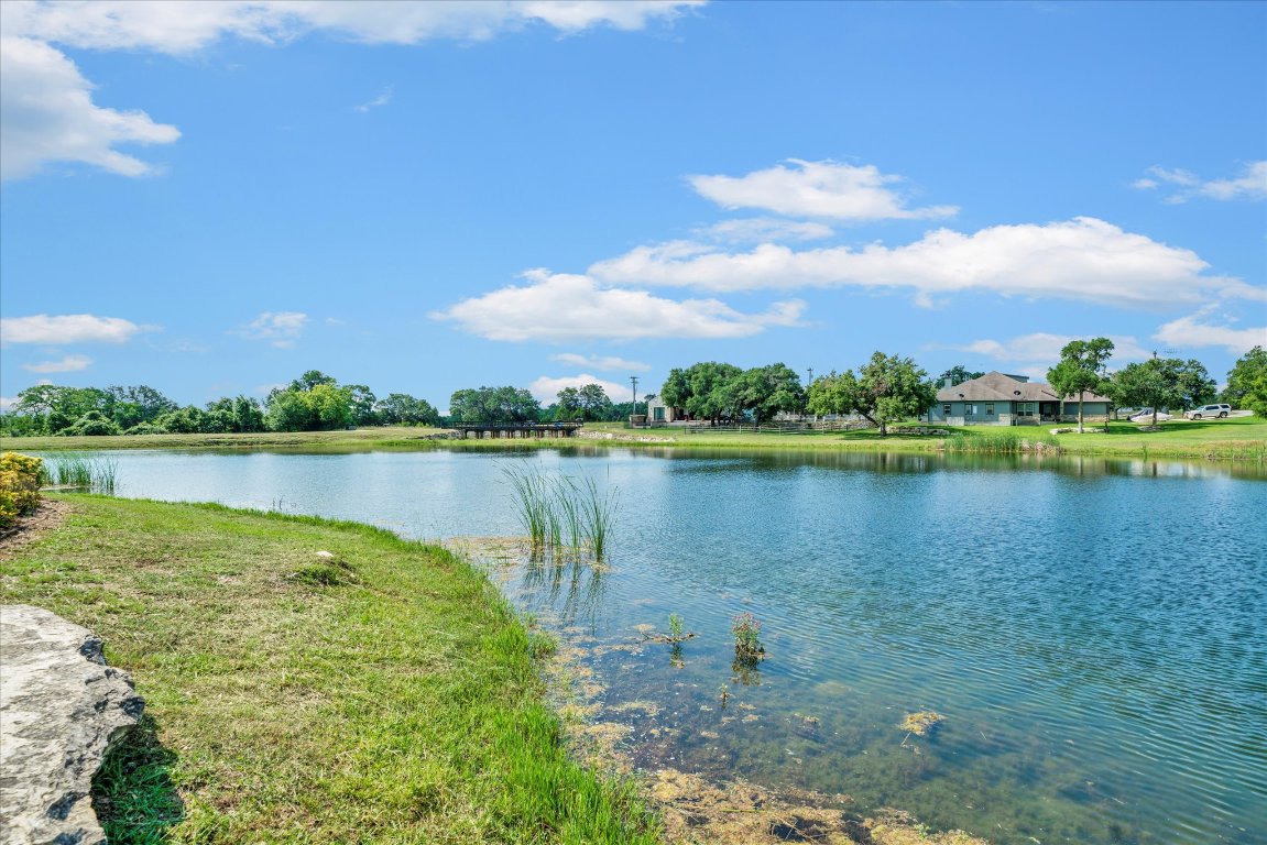 121 South Jesse Stiff Blanco, TX 78606 - Photo 7 of 17 a view of a lake with houses in the back