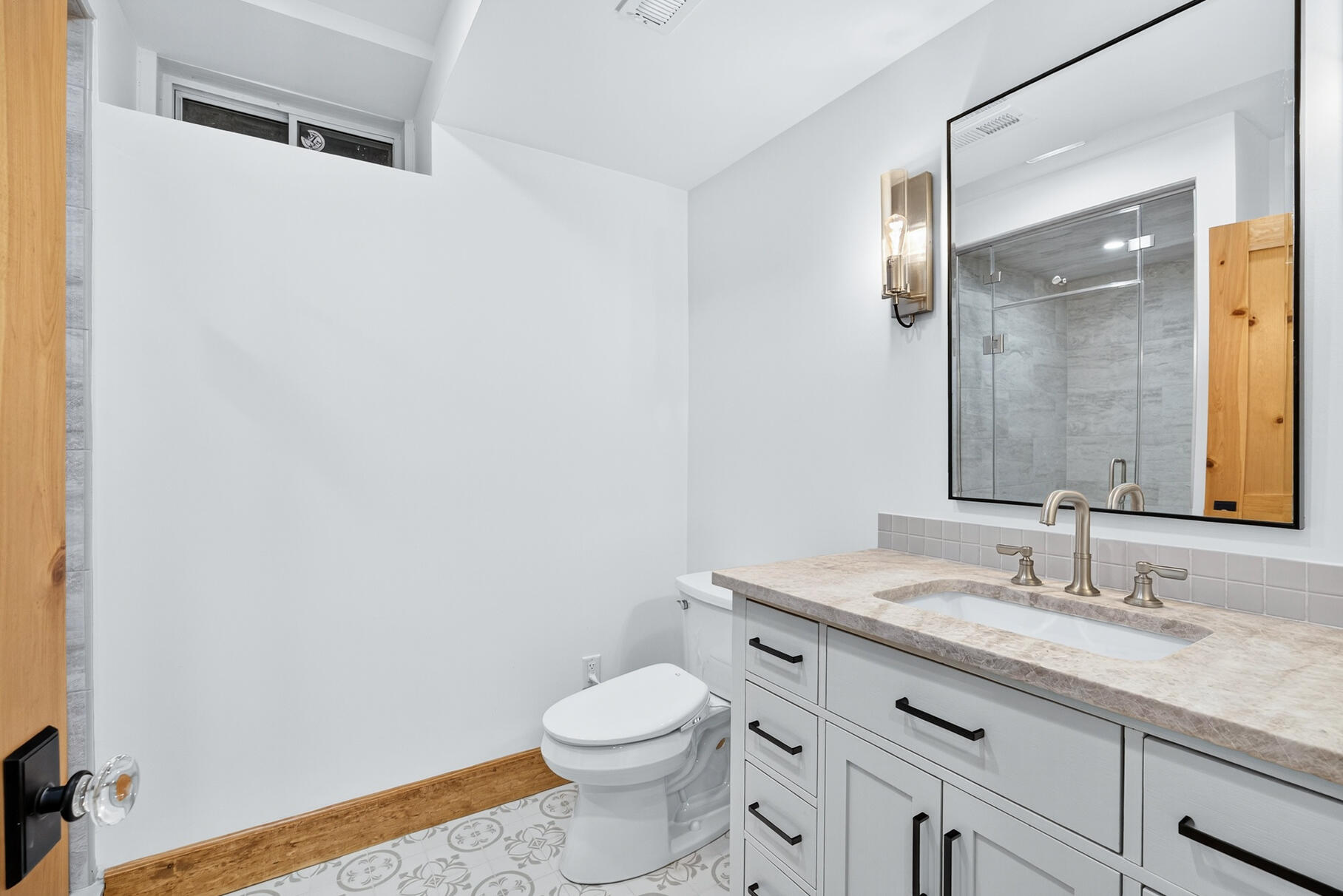 131 Timberlane Drive Mashpee, MA 02649 - Photo 47 of 57 a bathroom with a granite countertop sink a toilet and a mirror