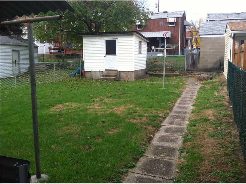 26 Rudolph Street McKees Rocks, PA 15136 - Photo 2 of 11 Exterior Back. Level yard with small shed