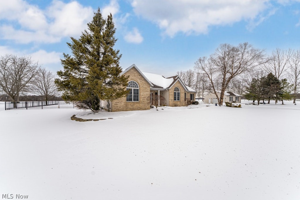 41341 Ravines Edge Way Lagrange, OH 44050 - Photo 2 of 50 Another view of the house showing the 2-1/2 car detached garage & the black Wrought Iron fence