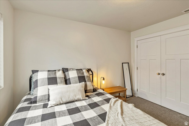 287 North 100th West Morgan, UT 84050 - Photo 20 of 27 Bedroom featuring carpet floors and a closet