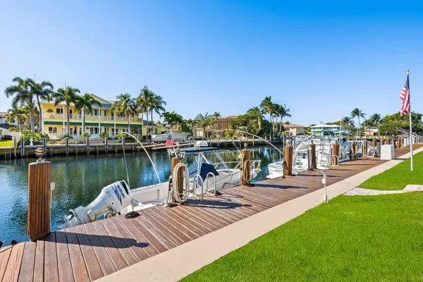 a view of a lake with a table and chairs