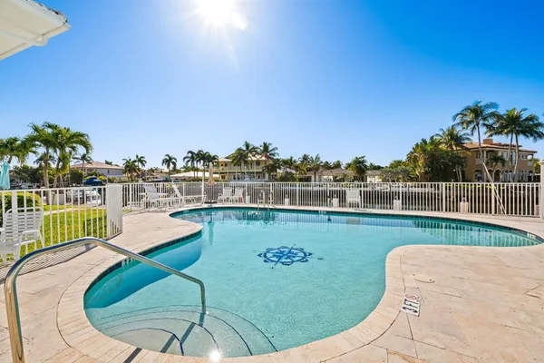 a view of a swimming pool with a lounge chair