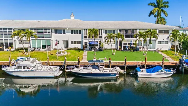 a view of a swimming pool with outdoor seating