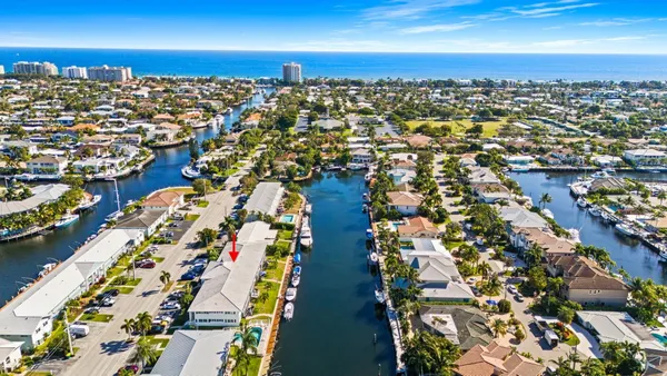 an aerial view of residential houses with outdoor space