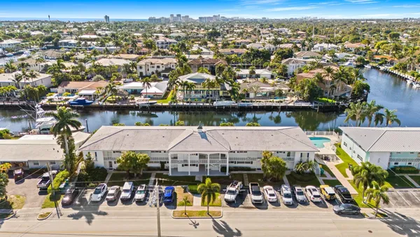 an aerial view of a house with outdoor space swimming pool
