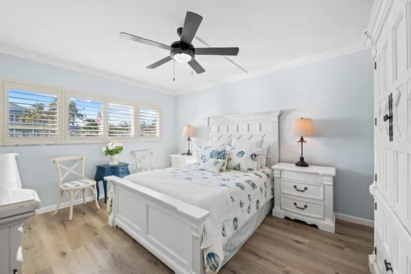 a bedroom with a bed and a table