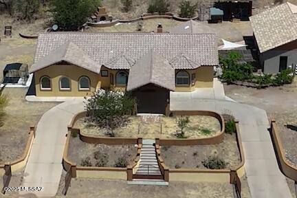 480 Camino Ramanote Rio Rico, AZ 85648 - Photo 2 of 43 Custom built home includes outstanding features include custom metalwork gated circular entry and portico.