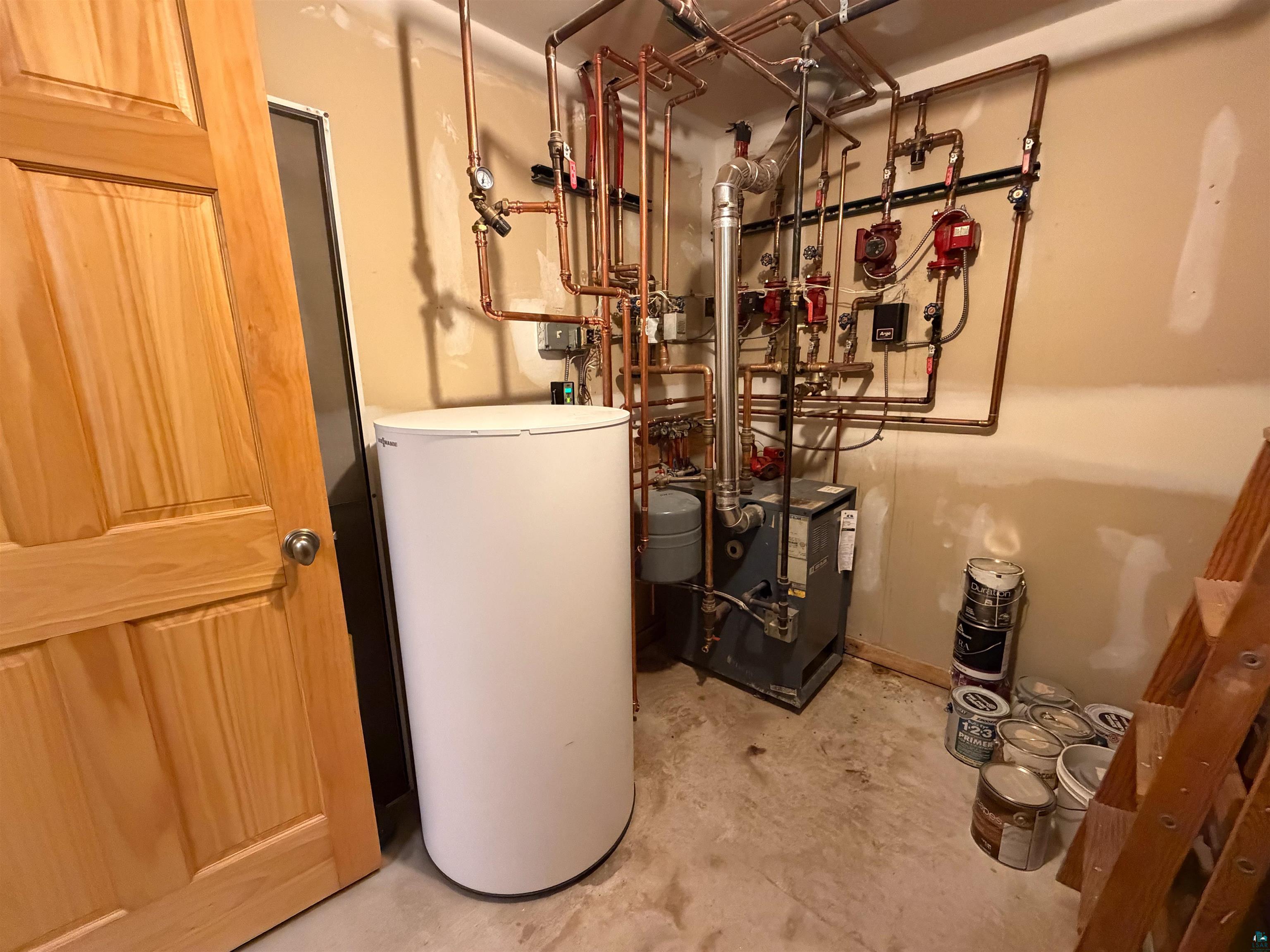 13 West 8th Street Duluth, MN 55806 - Photo 47 of 57 Utility room featuring a water heater, boiler system, and extensive copper piping