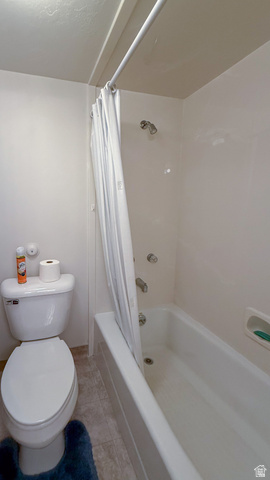 143 East Chestnut Street Helper, UT 84526 - Photo 30 of 35 Bathroom featuring shower / bath combo with shower curtain and light tile patterned flooring