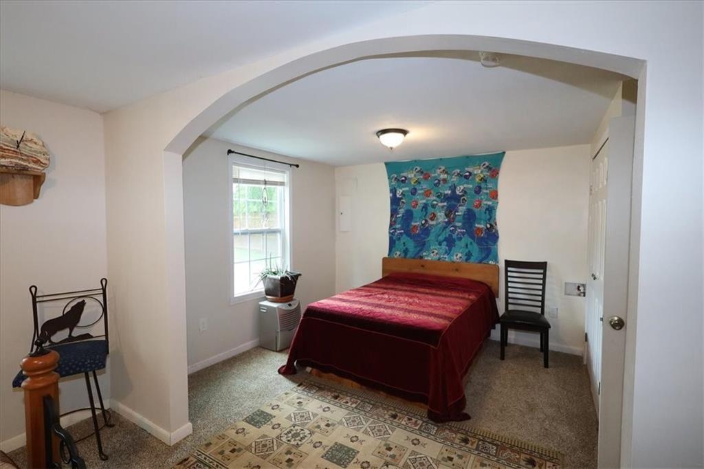 236 Hiram Sudie Road Dallas, GA 30157 - Photo 20 of 26 a bedroom with a bed and a window