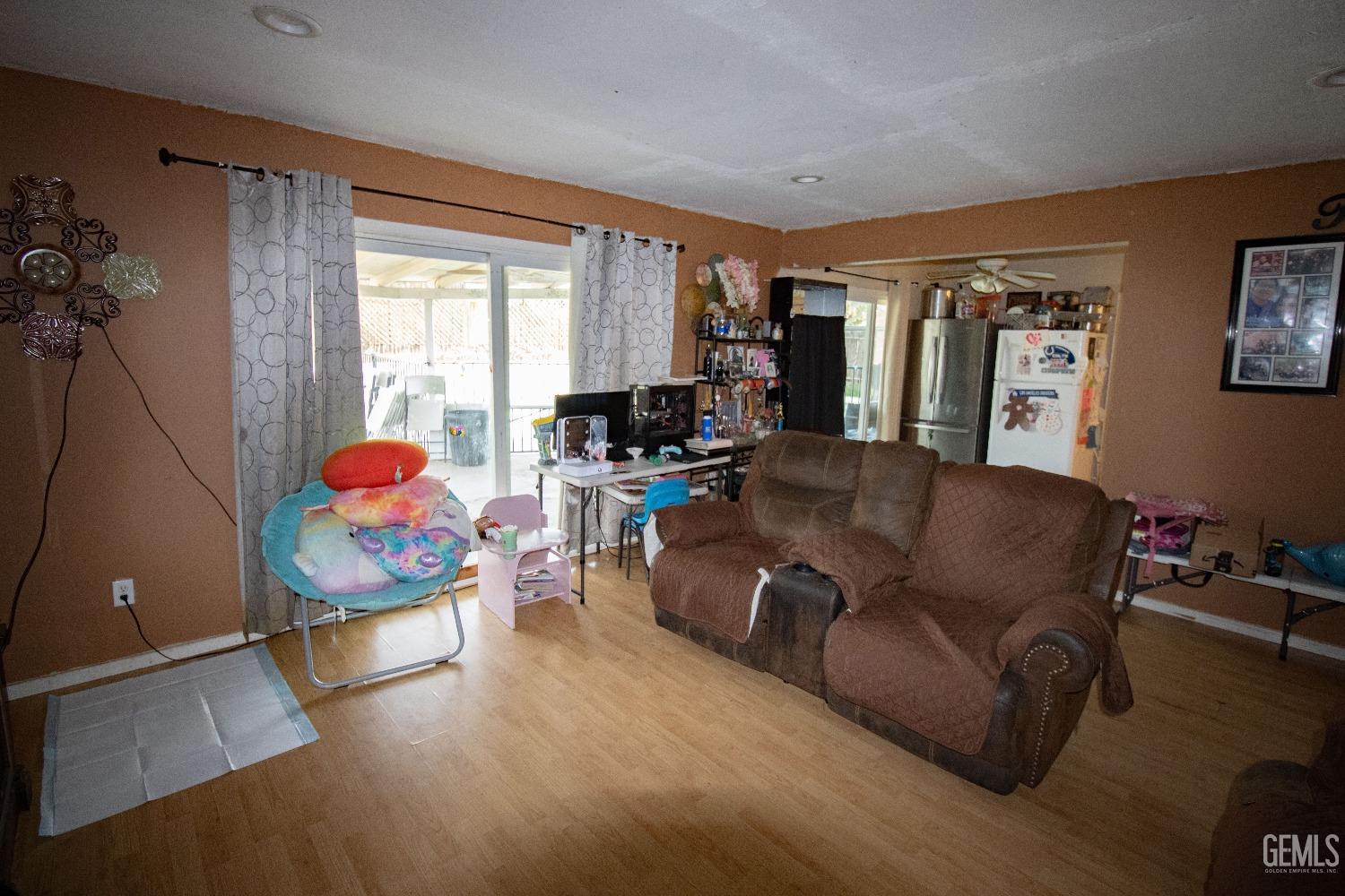 Undisclosed Address Bakersfield, CA 93306 - Photo 3 of 9 a living room with furniture and a window