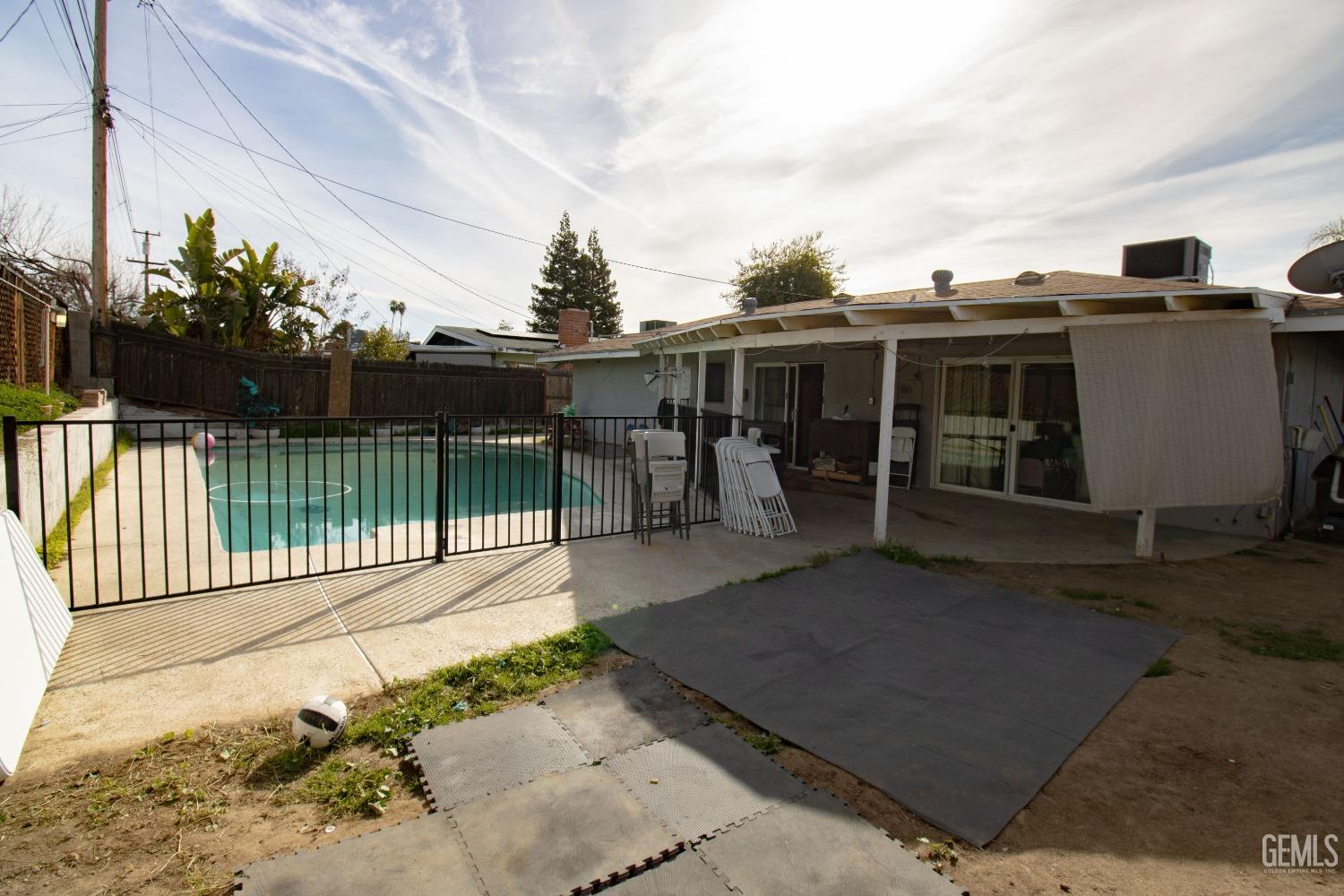 Undisclosed Address Bakersfield, CA 93306 - Photo 7 of 9 a view of a house with a backyard